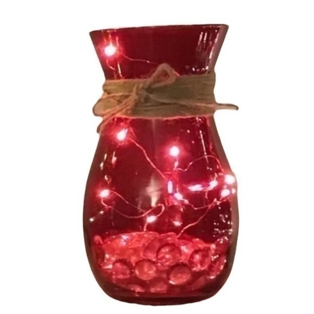 Red vase with string fairy lights